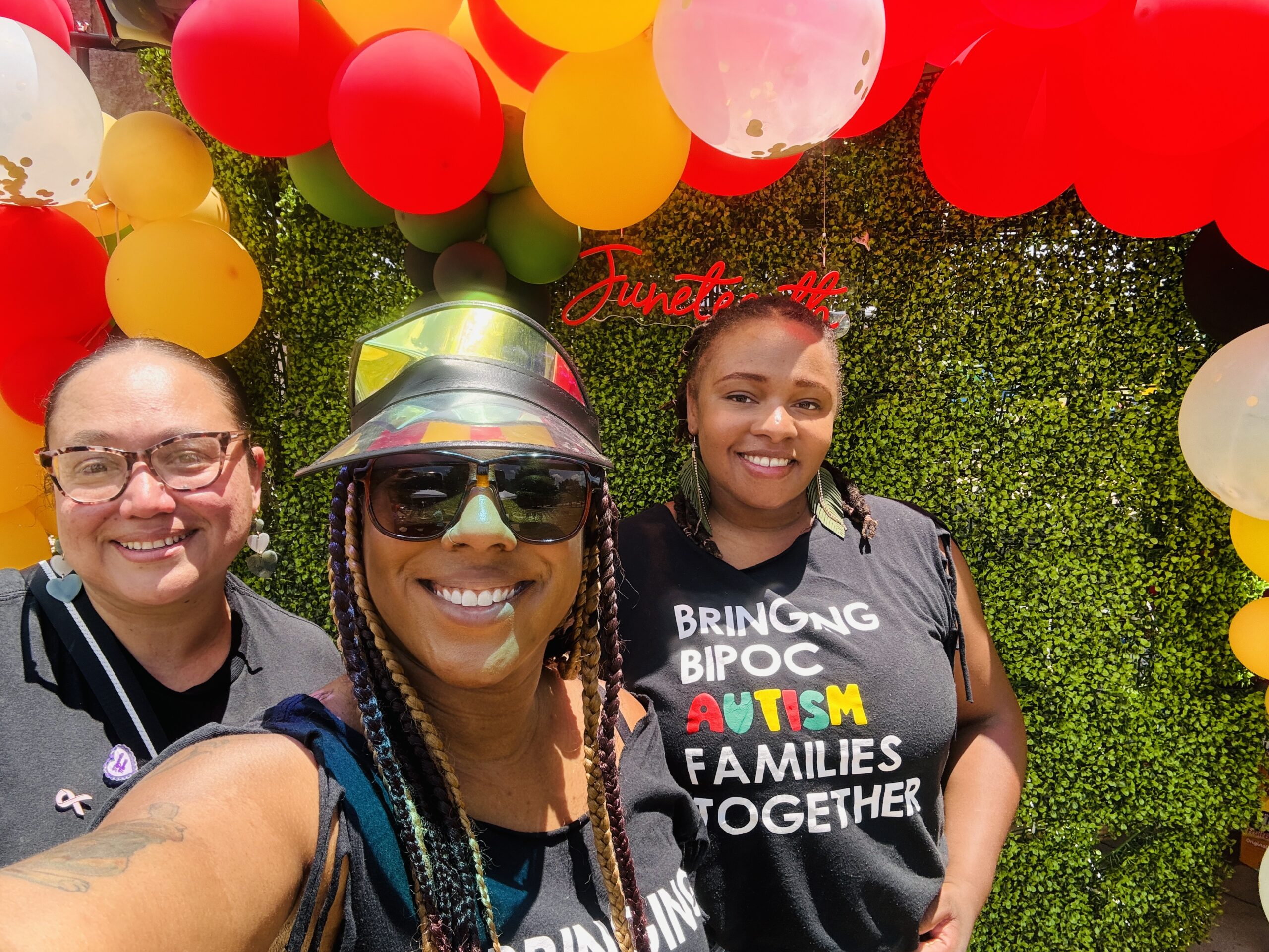 Crystal taking a selfie of her and two other women at GAPS event.